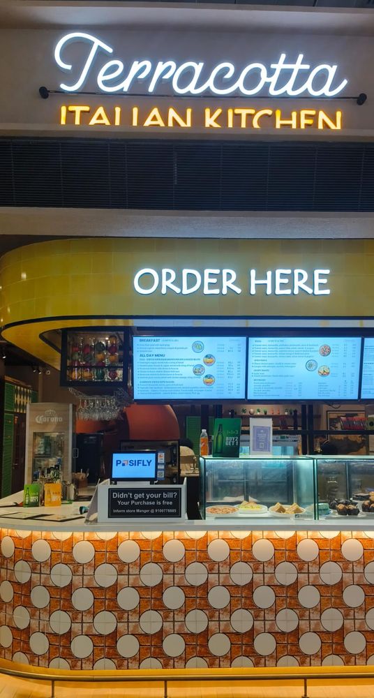 NukkadShops POS at the Terracotta Italian Kitchen order counter, Hyderabad Airport