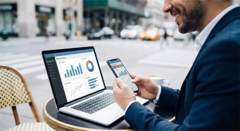 Sales reports and analytics on laptop and phone